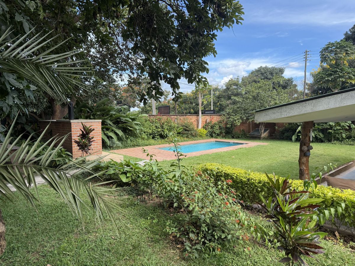 The Crafted Residence garden and pool